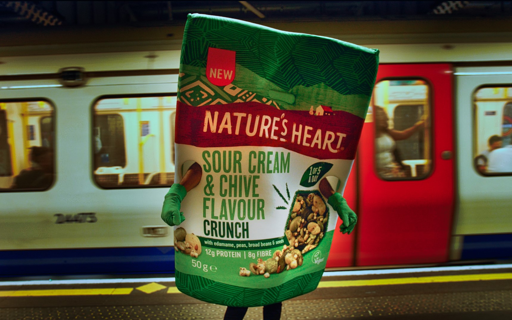 A larger than life Nature's Heart Crunch packet on the tube