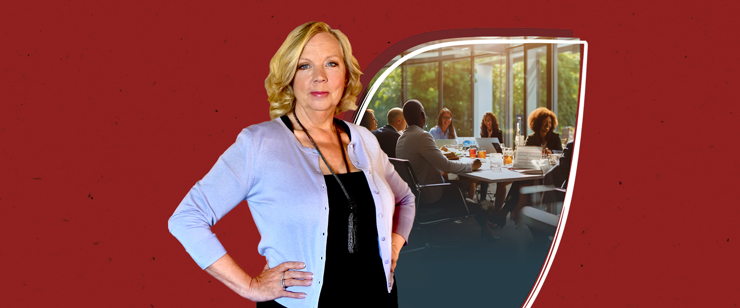 Dark red background with a cut out image of a group of people working at a desk, standing in front is a blonde woman.
