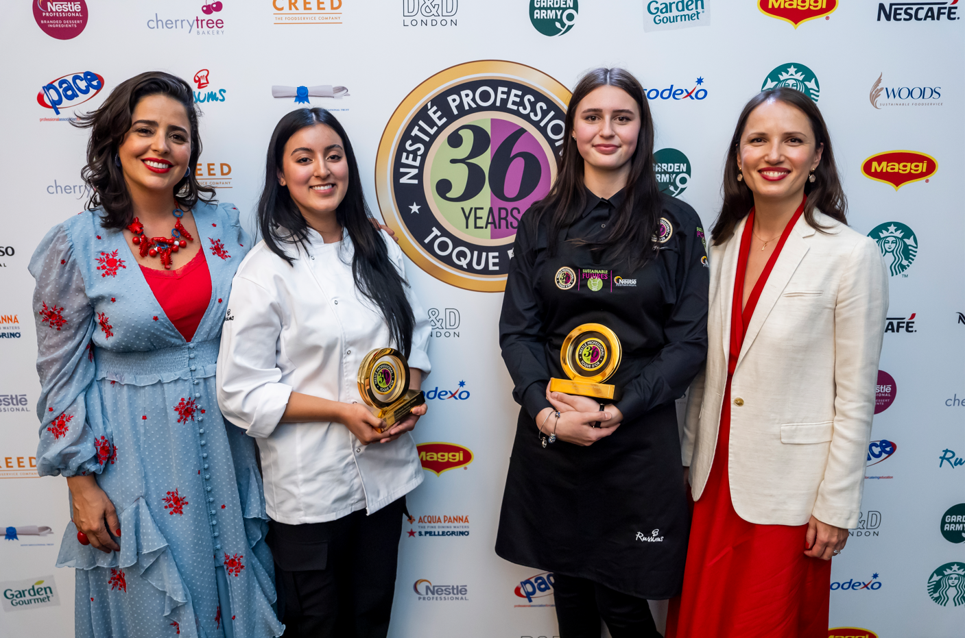 Toque d'Or® champions stand alongside with judges