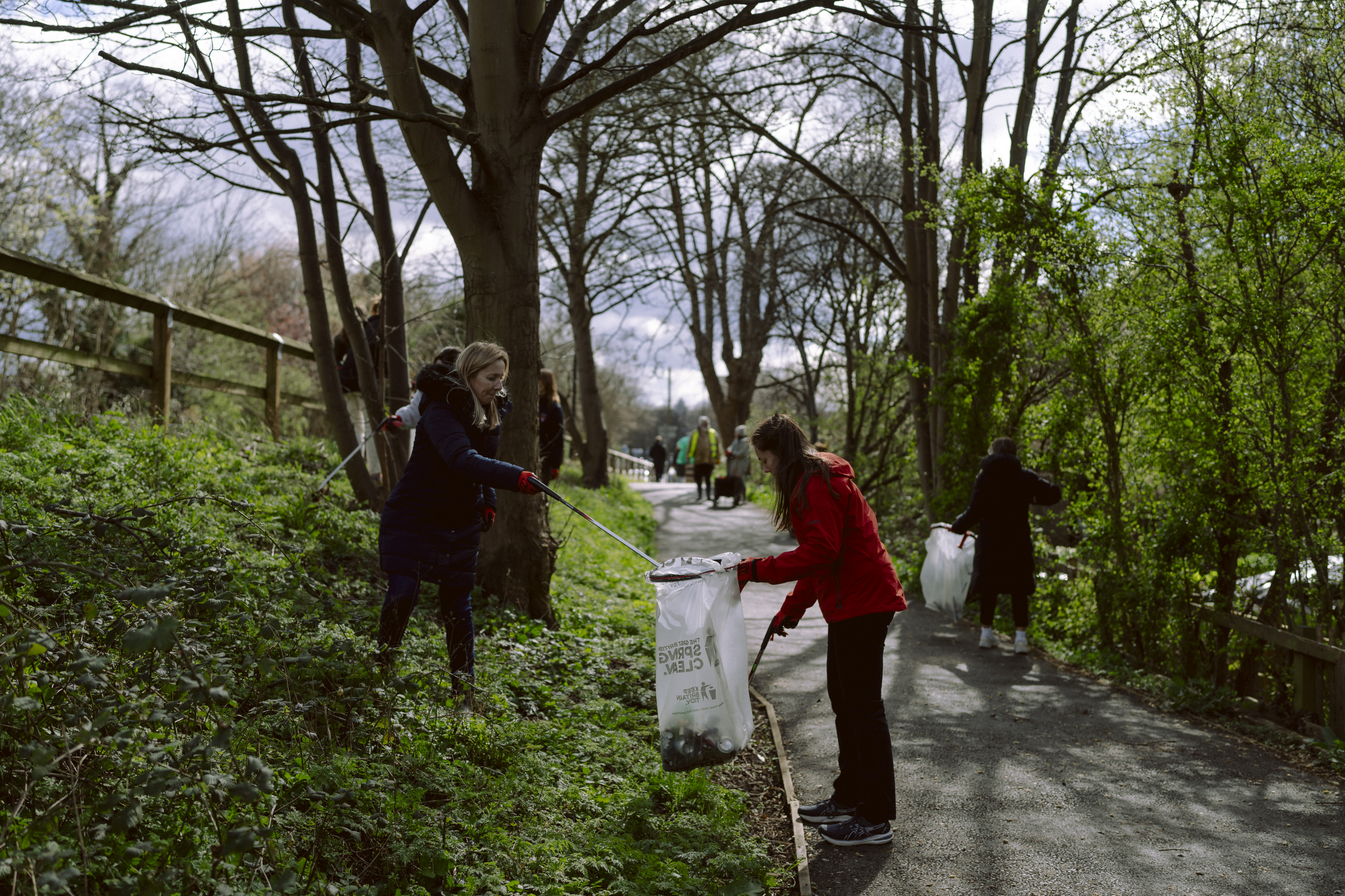 Two women doing a litter pick