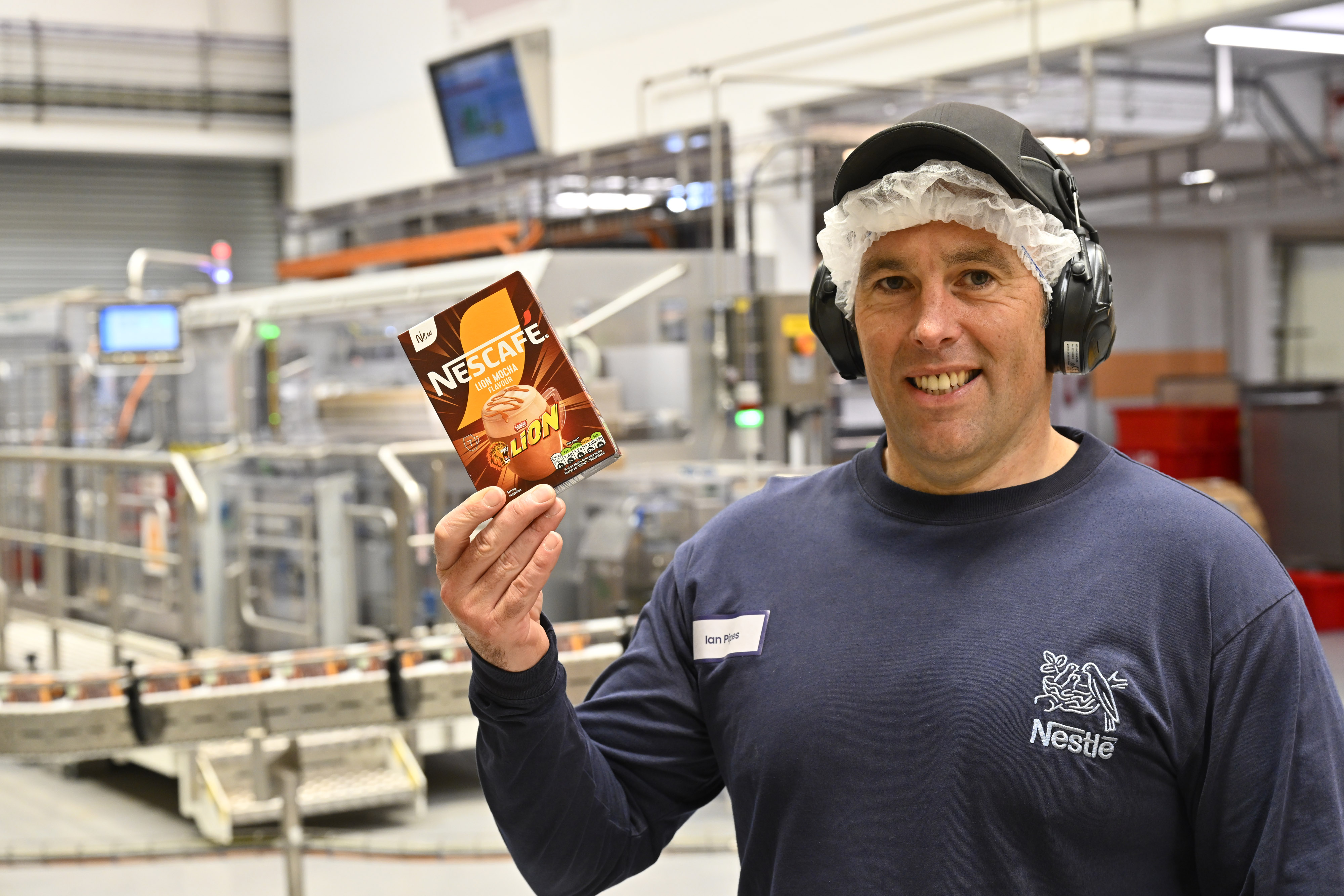 Man holding Nescafé Lion Flavour Mocha