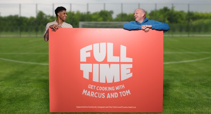 Marcus Rashford and Tom Kerridge hold a sign promoting Full Time Meals
