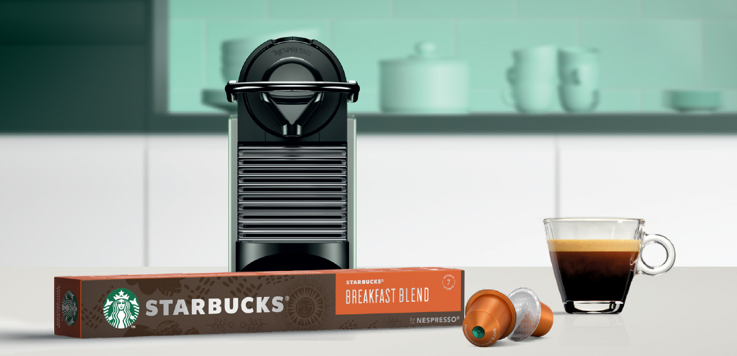 cup of coffee with machine and pod