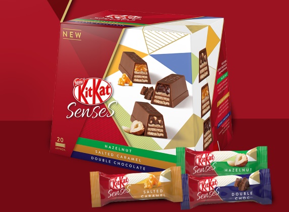 Kitkat senses box with three wrapped chocolates next to it; salted caramel, hazelnut and double chocolate