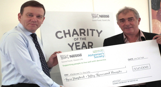 Paul Grimwoof presents cheque to Alzheimer's Society