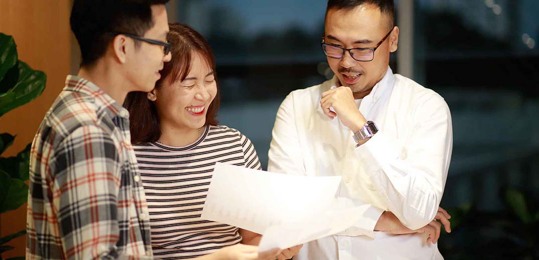 three people talking