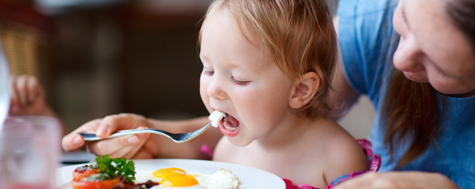 Mother and daughter eating
