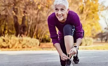 woman tying her shoes