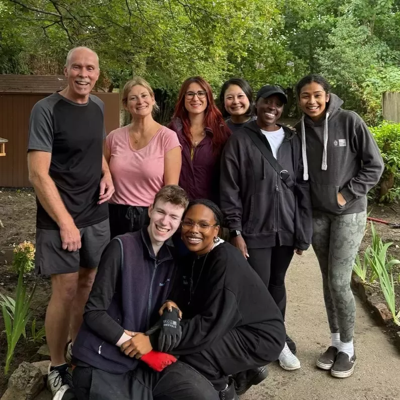 Group of colleagues outside in a garden. 