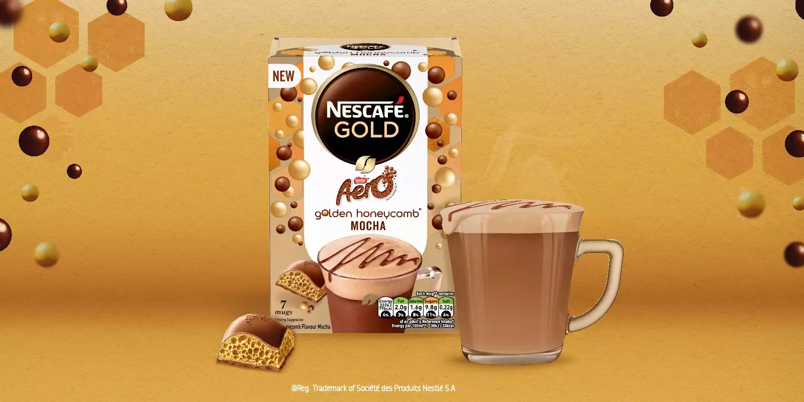 A cup of mocha in front of the new Nescafé Gold Golden Honeycomb Aero Mocha pack on a golden background