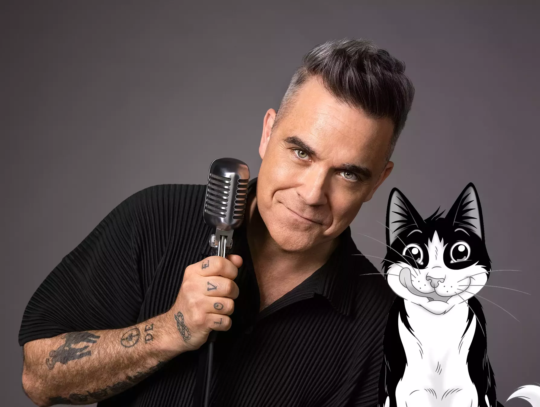 Robbie Williams holding a mic next to Felix the cat