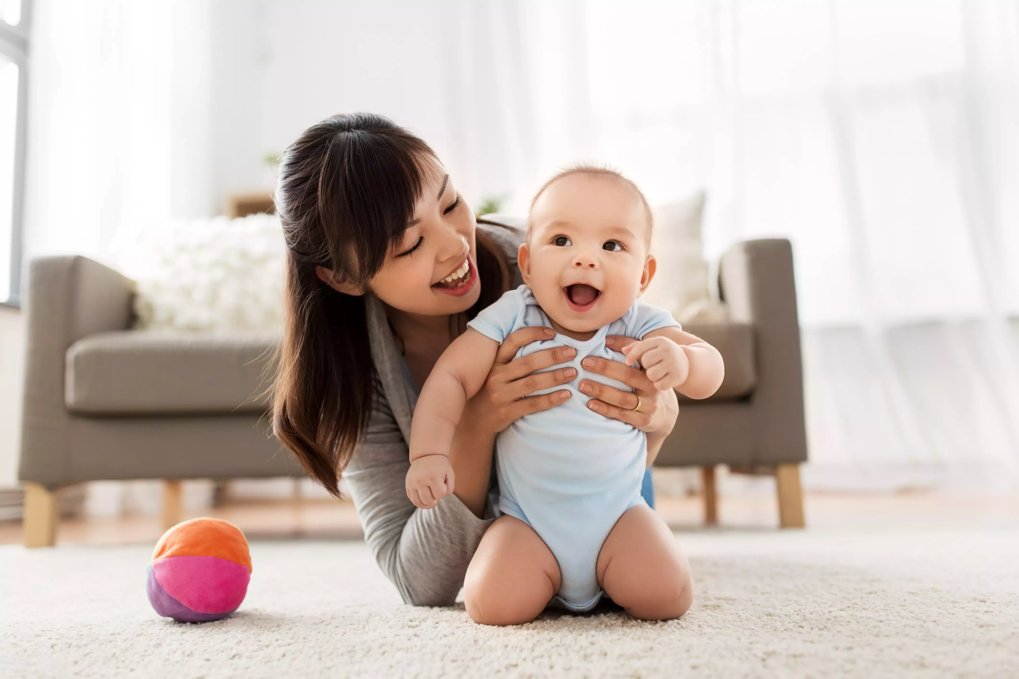 Woman playing with baby