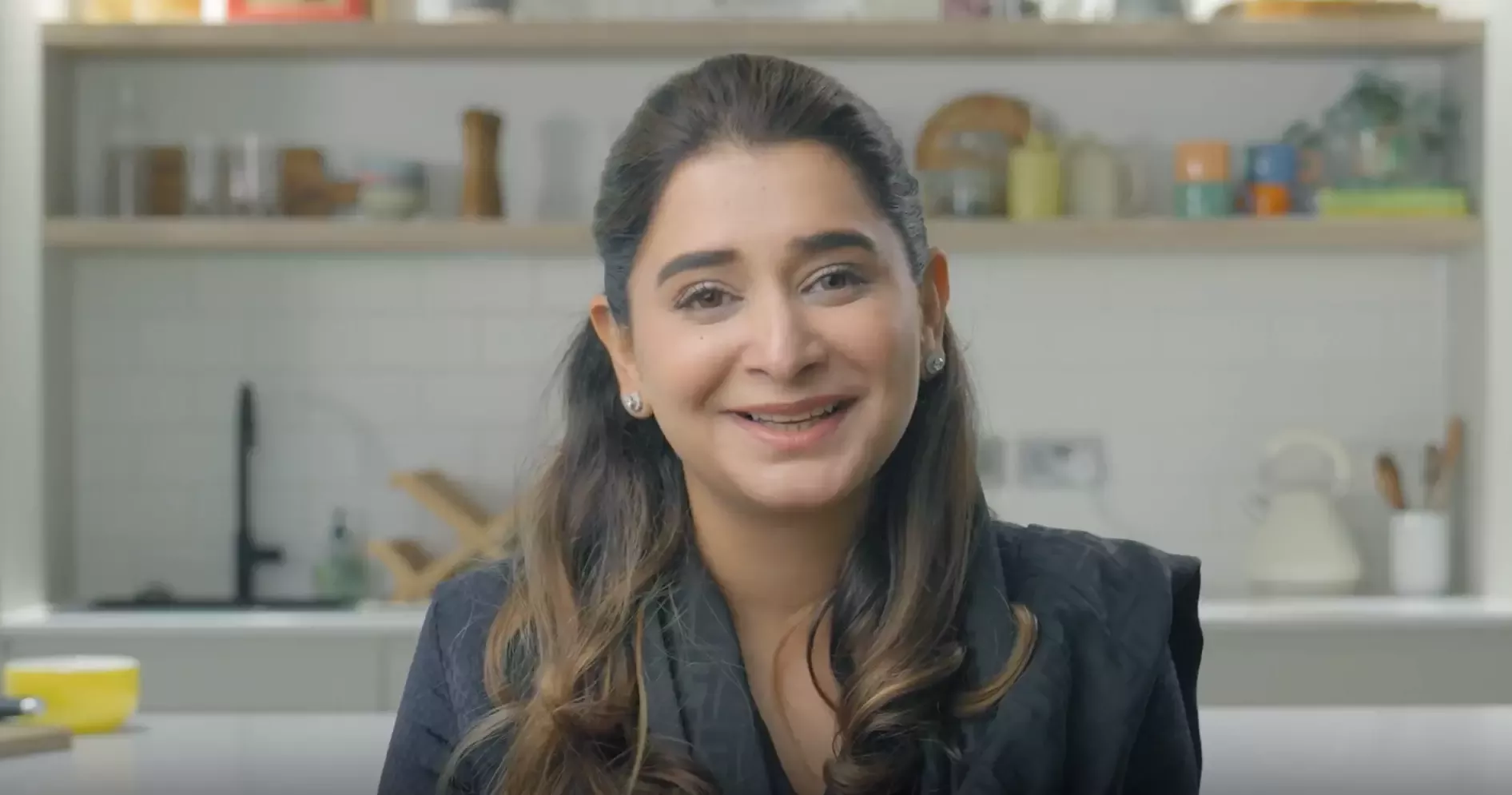 Amna smiling at the camera