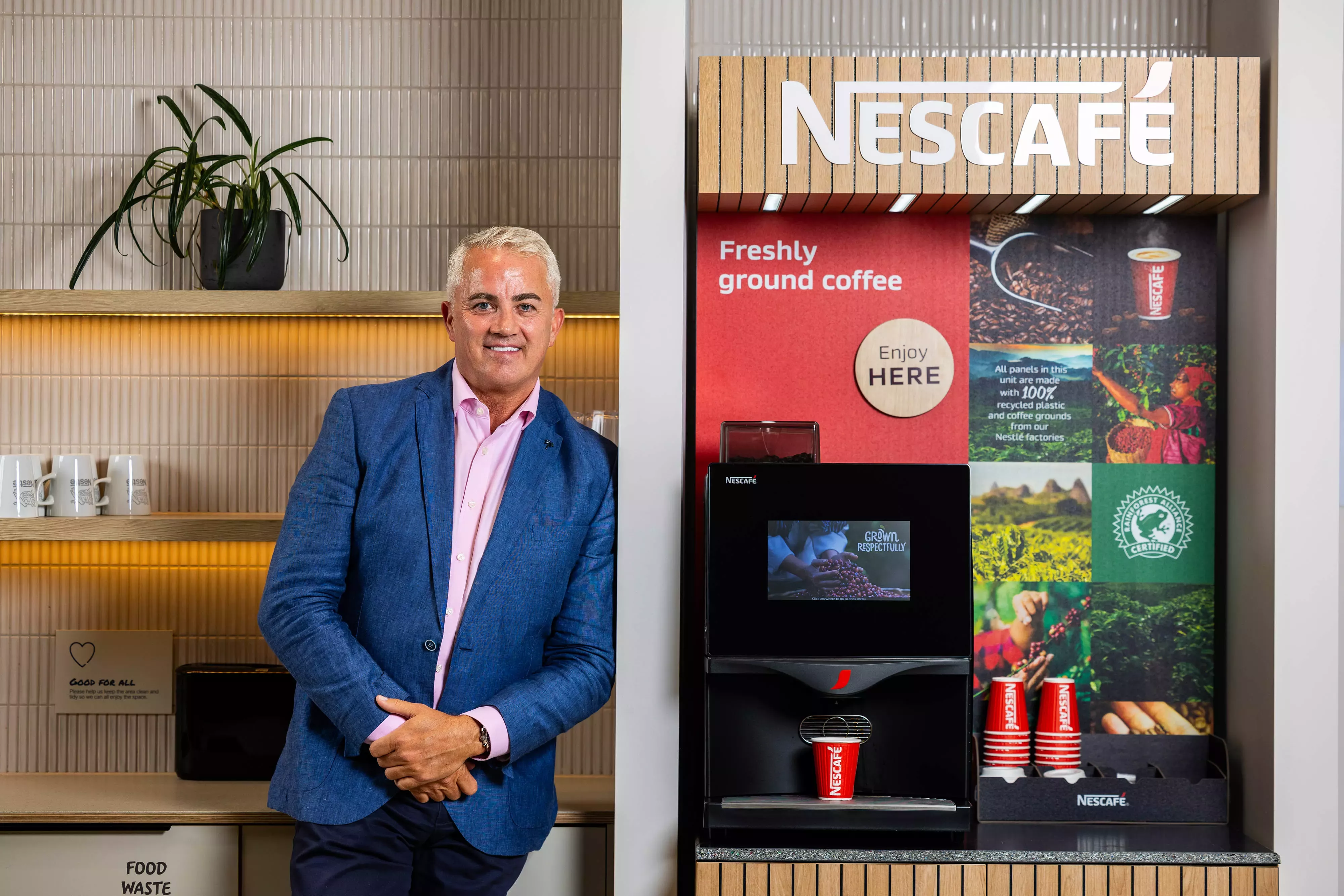 Stuart standing next to the Nescafé machine