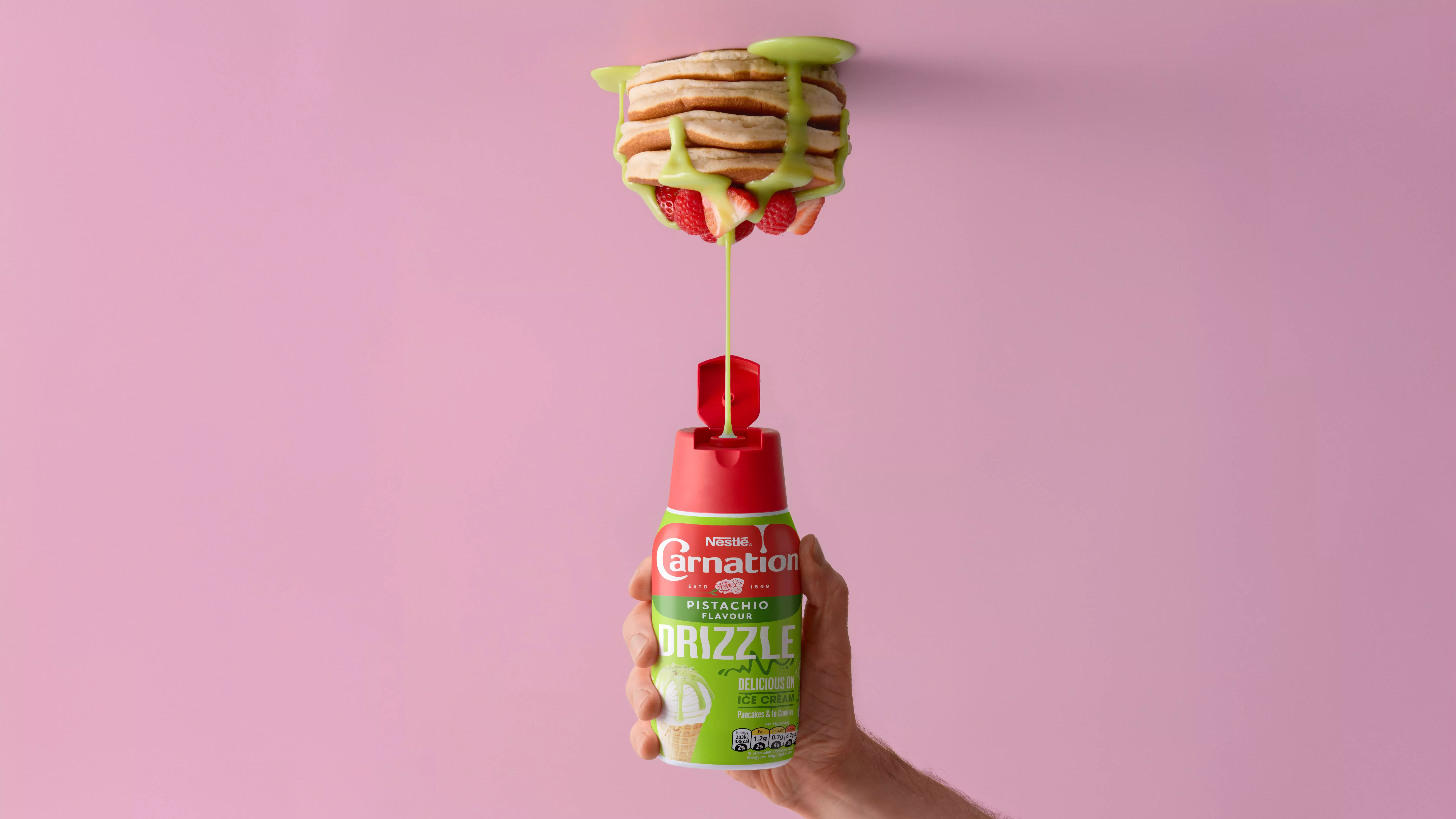 Carnation Pistachio Drizzle being poured onto pancakes