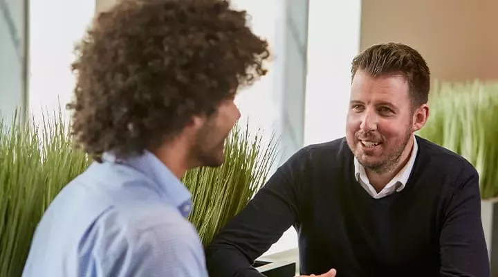 Two men talking