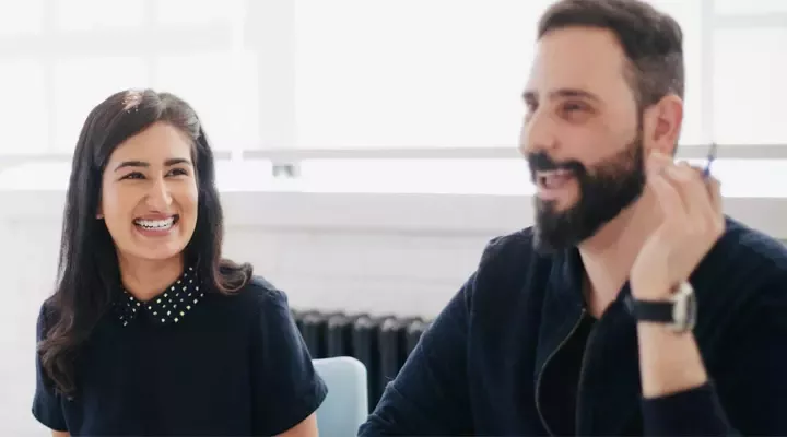 woman watching to a man who talks