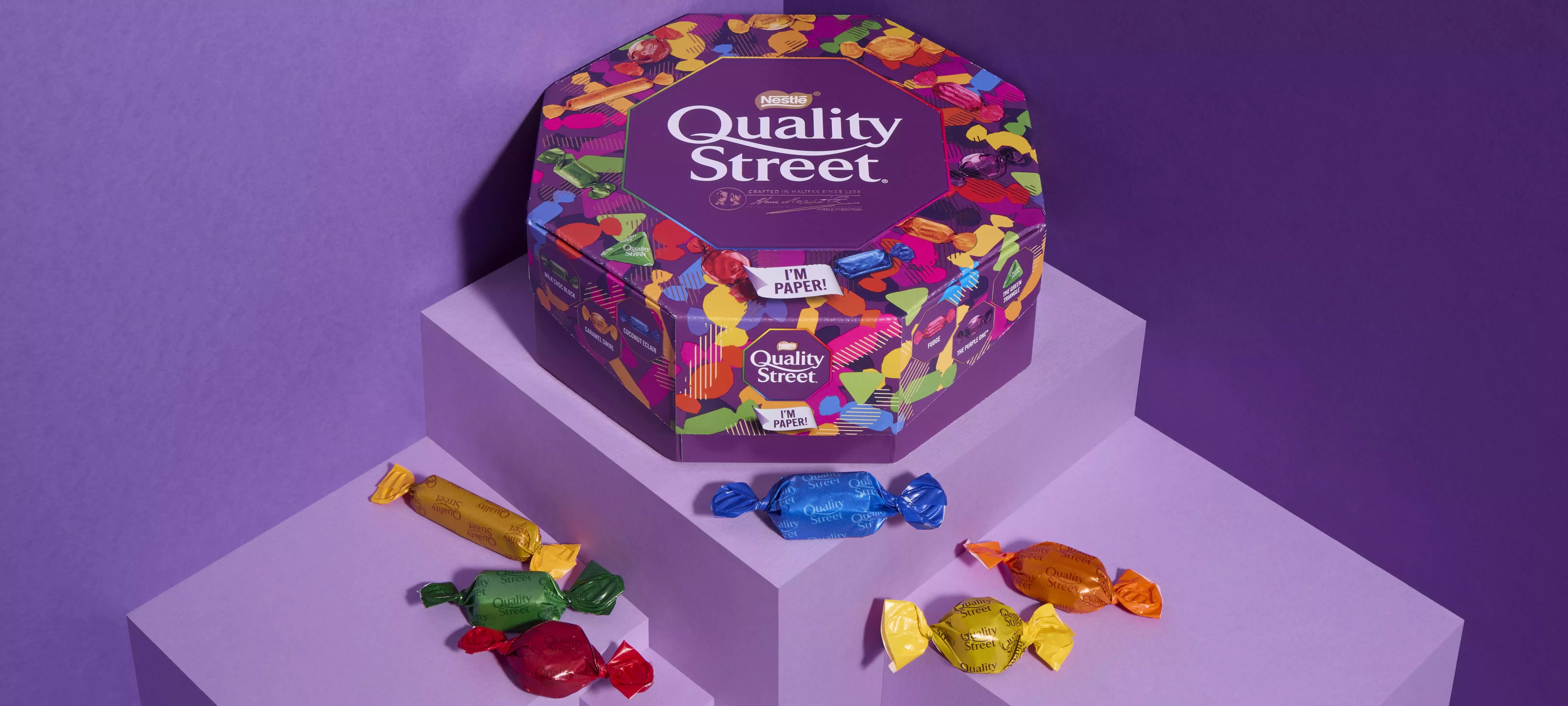 Quality Street paper tub and sweet wrappers