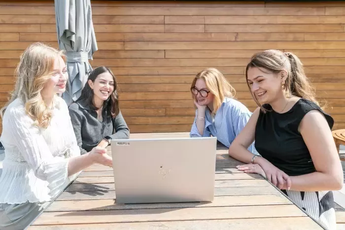 colleagues with a laptop