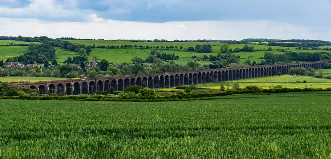 green fields viaduct in distance