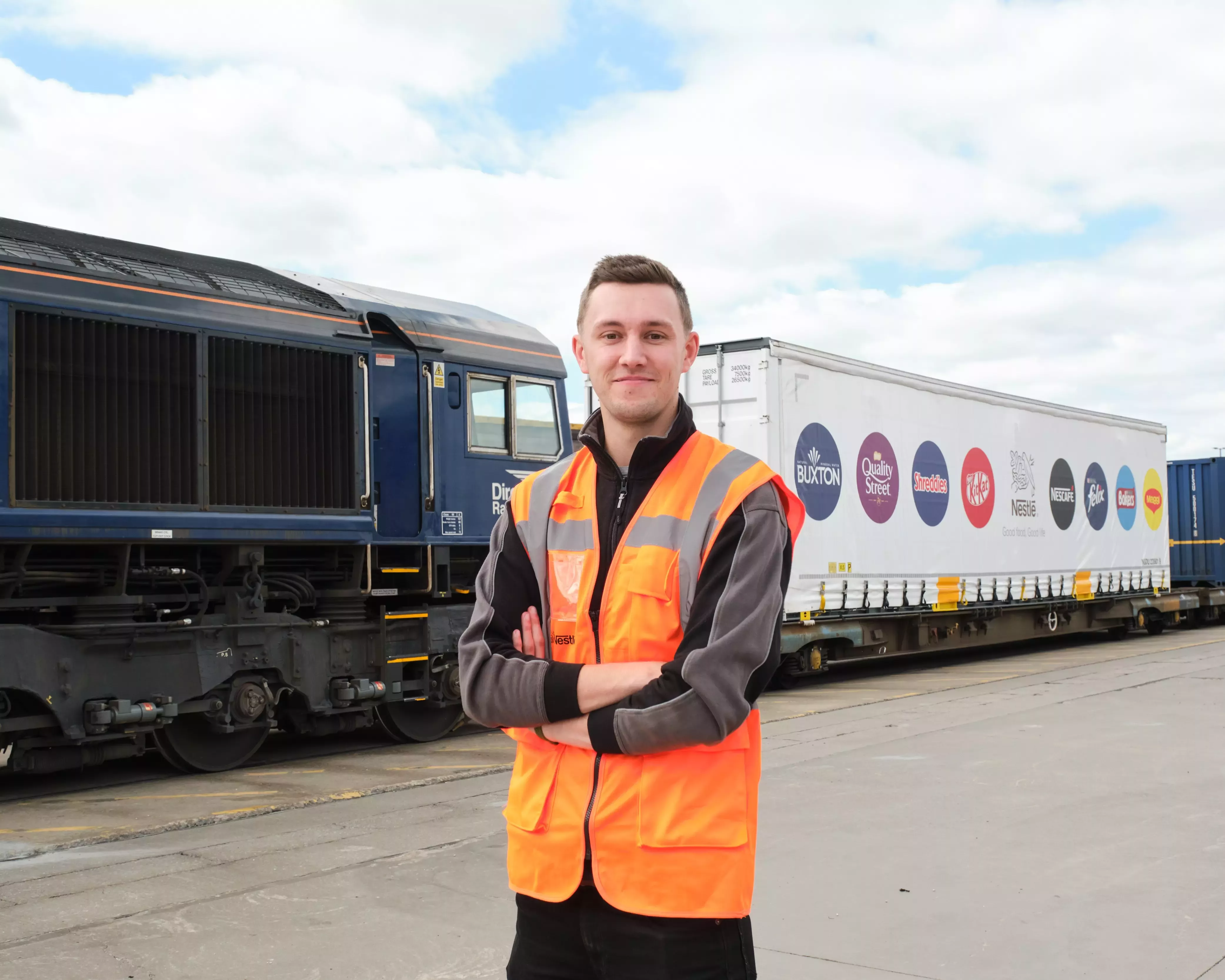 Niall standing in front of rail container