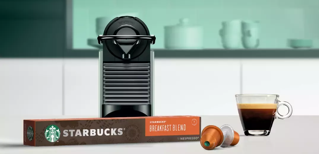 cup of coffee with machine and pod