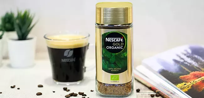 nescafe gold organic coffee on the table
