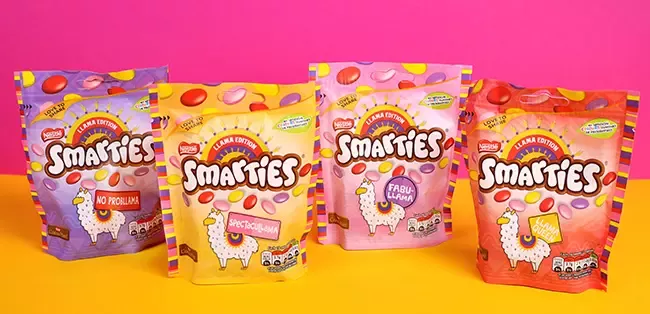 smarties on pink and yellow background